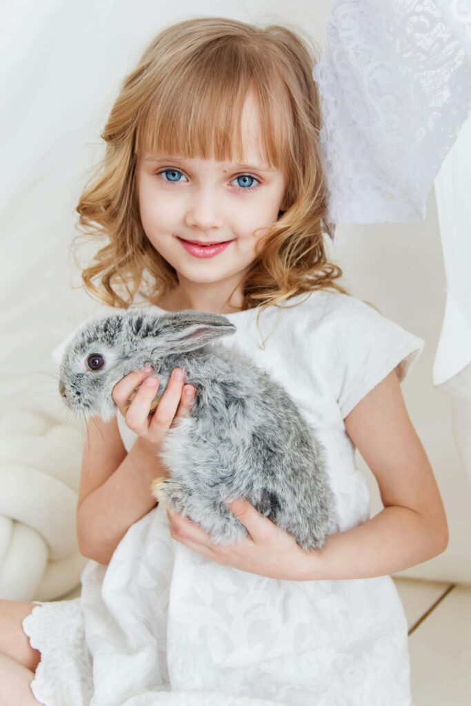 girl holding rabbit