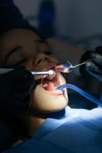 orthodontist working on patient